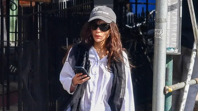 Black Pants and Sneakers Won't Look Dated If You Wear This Chic-Girl Accessory Trend