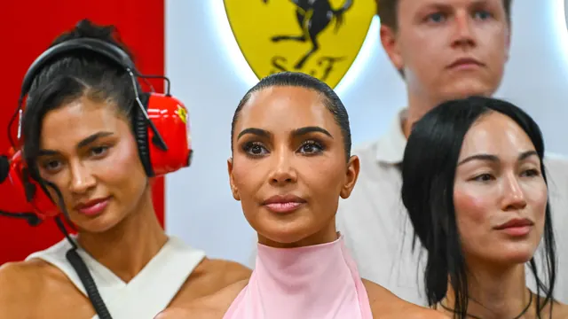Forget Ferrari Red: Kim Kardashian Pulls up to the Paddock in Pastel Pink